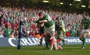 19 March 2005; Anthony Foley, Ireland, is tackled by Shane Williams, Wales. RBS Six Nations Championship 2005, Wales v Ireland, Millennium Stadium, Cardiff, Wales. Picture credit; Brendan Moran / SPORTSFILE