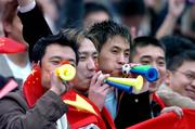 29 March 2005; Chinese supporters cheer on their team before the start of the game. International Friendly, Republic of Ireland v China, Lansdowne Road, Dublin Picture credit; David Maher / SPORTSFILE