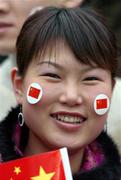 29 March 2005; A Chinese supporter cheers on her team before the start of the game. International Friendly, Republic of Ireland v China, Lansdowne Road, Dublin Picture credit; David Maher / SPORTSFILE
