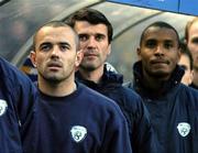29 March 2005; Republic of Ireland players left to right, Stephen Carr, Roy Keane and Clinton Morrison, stand in their dugout during the national anthem before the start of the game. International Friendly, Republic of Ireland v China, Lansdowne Road, Dublin Picture credit; David Maher / SPORTSFILE
