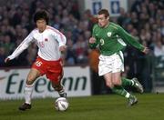 29 March 2005; Stephen Elliott, Republic of Ireland, in action against Ji Mingyi, China. International Friendly, Republic of Ireland v China, Lansdowne Road, Dublin Picture credit; Brian Lawless / SPORTSFILE