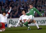 29 March 2005; Stephen Elliott, Republic of Ireland, in action against Ji Mingyi and Li Weifeng, left, China. International Friendly, Republic of Ireland v China, Lansdowne Road, Dublin Picture credit; Brian Lawless / SPORTSFILE