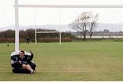 6 October 1999; Australia's Tim Horan sits in an inflatable chair at a squad training session in Portmarnock after he broke the Guinness try challenge during their game against Romania. Tim scored Australia's first try in under 119.5 seconds, the time it takes to pour the perfect pint of Guinness. As a result, Tim received a year's supply of Guinness and there was a £10,000 donation to the charity of Tim's choice. Australia Rugby Squad Training, Portmarnock Hotel and Golf Links, Dublin. Picture credit: Brendan Moran / SPORTSFILE