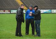 5 January 2014; Referee Padraig Hughes, left, in discussion with St Mary's manager Paddy Tally, centre, and Fermanagh manager Peter McGrath during a pitch inspection which resulted in the game being called off. Power NI Dr. McKenna Cup, Section B, Round 1, Fermanagh v St Mary's, Brewster Park, Enniskillen, Co. Fermanagh. Picture credit: Oliver McVeigh / SPORTSFILE