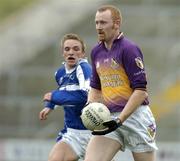 3 April 2005; Brendan Doyle, Wexford, in action against Ross Munnelly, Laois. Allianz National Football League, Division 1B, Wexford v Laois, Wexford Park, Wexford. Picture credit; Matt Browne / SPORTSFILE