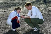 6 April 2005; European 400m champion David Gillick admires the Bronze medal that Special Olympic athlete Fiona Bryson won at the recent World Winter Games, at the launch of Get Up, Get Out, and GO - a major fundraising and recruitment drive for Special Olympics Ireland to help recruit 8,000 new athletes by 2007. Iveagh Gardens, Harcourt St., Dublin. Picture credit; Ray McManus / SPORTSFILE