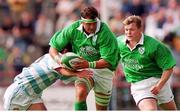28 August 1999; Dion O'Cuinneagain, Ireland, is tackled by Lisandro Arbizu, Argentina, supported by teammate Brian O'Driscoll. Rugby International, Ireland v Argentina, Lansdowne Road, Dublin. Picture credit: Brendan Moran / SPORTSFILE