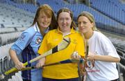 11 April 2005; Camogie players Ciara Tallon, Kildare, right, and Anne McCluskey, Dublin, left, with Special Olympics Athlete Aine Lawlor, from Marino, Dublin, at the announcement that Special Olympics Ireland are to be the Camogie Association's nominated charity for 2005. Croke Park, Dublin. Picture credit; Ray McManus / SPORTSFILE