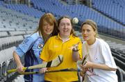 11 April 2005; Camogie players Ciara Tallon, Kildare, right,  and Anne McCluskey, Dublin, left, with Special Olympics Athlete Aine Lawlor, from Marino, Dublin, at the announcement that Special Olympics Ireland are to be the Camogie Association's nominated charity for 2005. Croke Park, Dublin. Picture credit; Ray McManus / SPORTSFILE