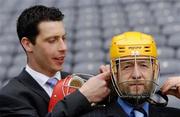 13 April 2005; GAA President Sean Kelly at the launch of Mycro's new helmet which was designed by Cork hurler Ronan Curran, left. Croke Park, Dublin. Picture credit; David Maher / SPORTSFILE