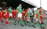 11 April 2005;  Cork City captain Dan Murray, left, with Vinny Arkins, Portadown captain, lead out the teams before the start of the game. Setanta Cup, Group 2, Portadown v Cork City, Shamrock Park, Portadown, Co. Armagh. Picture credit; David Maher / SPORTSFILE