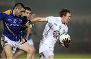 8 January 2014; Paul Cribbin, Kildare, in action against Brian Farrell, Longford. Bord na Mona O'Byrne Cup, Group B, Round 2, Longford v Kildare, Newtowncashel, Co. Longford. Picture credit: David Maher / SPORTSFILE