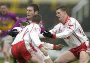 17 April 2005; Redmond Barry, Wexford, in action against Colin Holmes, right and Gavin Devlin, Tyrone. Allianz National Football League, Division 1 Semi-Final, Tyrone v Wexford, O'Moore Park, Portlaoise, Co. Laois. Picture credit; Pat Murphy / SPORTSFILE