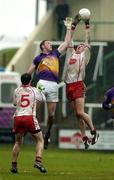 17 April 2005; Sean Cavanagh, Tyrone, in action against Nicky Lambert, Wexford. Allianz National Football League, Division 1 Semi-Final, Tyrone v Wexford, O'Moore Park, Portlaoise, Co. Laois. Picture credit; Pat Murphy / SPORTSFILE