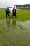 17 April 2005; Match referee Joe Murray and Helen O'Rourke, Chief Executive of the Ladies Football Association, inspects the pitch in advance of the match being called off. Suzuki Ladies National Football League Final, Galway v Cork, Dr. Hyde Park, Roscommon. Picture credit; Ray McManus / SPORTSFILE