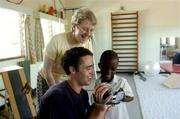 25 February 2005; Galway's Alan Kerins with Presentation Sister Stella and Albert watch a video of Albert talking. Cheshire home for the physically challenged children, Mongu, Zambia. Picture credit; Damien Eagers / SPORTSFILE