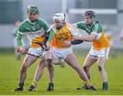 11 January 2014; Tomas Ó Ciarain, Antrim, in action against Thomas Geraghty, left, and Kevin Connolly, Offaly. Bord Na Mona Walsh Cup, Round 1, Offaly v Antrim, O'Connor Park, Tullamore, Co. Offaly. Picture credit: Barry Cregg / SPORTSFILE