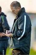 11 January 2014; Antrim manager Kevin Ryan takes notes on the sideline during the game. Bord Na Mona Walsh Cup, Round 1, Offaly v Antrim, O'Connor Park, Tullamore, Co. Offaly. Picture credit: Barry Cregg / SPORTSFILE