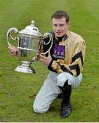 23 January 2014; Jockey Paul Townend with the Thyestes Cup after winning the Goffs Thyestes Handicap Steeplechase on On His Own. Gowran Park, Gowran, Co. Kilkenny. Picture credit: Matt Browne / SPORTSFILE