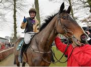 23 January 2014; Jockey Paul Townend is led into the parade ring after winning the Goffs Thyestes Handicap Steeplechase on On His Own. Gowran Park, Gowran, Co. Kilkenny. Picture credit: Matt Browne / SPORTSFILE