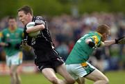 22 May 2005; Dermot McTiernan, Sligo, sidesteps the challenge of Michael McGuinness, Leitrim. Bank of Ireland Connacht Senior Football Championship, Leitrim v Sligo, O'Moore Park, Carrick-on-Shannon, Co. Leitrim. Picture credit; Damien Eagers / SPORTSFILE