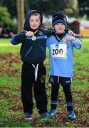 26 January 2014; James McNamee and Jamie Flynn, both aged six, from Portmarnock A.C., Co. Dublin, after completing the fun run during the 2014  Raheny 5 mile road race. St. Anne's Park, Raheny, Dublin. Picture credit: Tomás Greally / SPORTSFILE