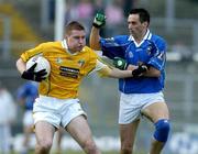 4 June 2005; Niall Enright, Antrim, in action against Paul Brady, Cavan. Bank of Ireland Ulster Senior Football Championship Replay, Antrim v Cavan, Casement Park, Belfast. Picture credit; Pat Murphy / SPORTSFILE