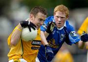 4 June 2005; Ciaran Close, Antrim, in action against Dermot McCabe, Cavan. Bank of Ireland Ulster Senior Football Championship Replay, Antrim v Cavan, Casement Park, Belfast. Picture credit; Pat Murphy / SPORTSFILE