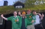 6 June 2005; Republic of Ireland supporters, left to right, Brian Hughes, Paul Muldrew, Lorcan Bermingham and Paul Coffey pictured in front of a house with a traditional roof in Torshavn in advance of the Faroe Islands v Ireland game. Torshavn, Faroe Islands. Picture credit; Damien Eagers / SPORTSFILE