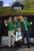 6 June 2005; Republic of Ireland supporters, left to right, Brian Hughes, Paul Muldrew, Lorcan Bermingham and Paul Coffey pictured in front of a house with a traditional roof in Torshavn in advance of the Faroe Islands v Ireland game. Torshavn, Faroe Islands. Picture credit; Damien Eagers / SPORTSFILE