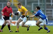 4 June 2005; Niall Enright, Antrim, in action against Paul Brady, Cavan. Bank of Ireland Ulster Senior Football Championship Replay, Antrim v Cavan, Casement Park, Belfast. Picture credit; Pat Murphy / SPORTSFILE