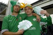 8 June 2005; Stranded Republic of Ireland supporters Karl McGrath, from Dublin, left, and Oisin Gartlan, from Monaghan, with their match tickets at Dublin airport after their flight to the Faroe Islands for the 2006 FIFA World Cup Qualifiying match between the Faroe Islands and the Republic of Ireland was cancelled due to bad weather in the Faroe Islands. Dublin Airport, Dublin. Picture credit; Pat Murphy / SPORTSFILE