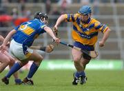 5 June 2005; Andrew Quinn, Clare, in action against John Devane, Tipperary. Guinness Munster Senior Hurling Championship Semi-Final, Clare v Tipperary, Gaelic Grounds, Limerick. Picture credit; David Levingstone / SPORTSFILE