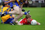 12 June 2005; Anthony Lynch, Cork, in action against Kevin Dilleen, 3, Clare. Bank of Ireland Munster Senior Football Championship Semi-Final, Clare v Cork, Cusack Park, Ennis, Co. Clare. Picture credit; Kieran Clancy / SPORTSFILE