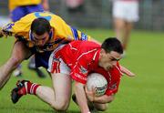 12 June 2005; Michael Cronin, Cork, in action against Alan Clohessy, Clare. Bank of Ireland Munster Senior Football Championship Semi-Final, Clare v Cork, Cusack Park, Ennis, Co. Clare. Picture credit; Kieran Clancy / SPORTSFILE