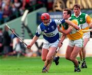 8 June 1997; Owen Coss of Laois in action against Kevin Martin of Offaly during the GAA Leinster Senior Hurling Championship Quarter-Final match between Offaly and Laois at Croke Park in Dublin. Photo by David Maher/Sportsfile