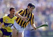 10 August 1997; Peter Barry of Kilkenny in action against P.J. O'Connell of Clare during the GAA All-Ireland Senior Hurling Championship Semi-Final match between Clare and Kilkenny at Croke Park in Dublin. Photo by Ray McManus/Sportsfile