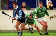 4 April 1999; Brendan McLoughlin of Dublin in action against James Butler, centre, and Mike Houlihan of Limerick during the Church and General National Hurling League Division 1A match between Dublin and Limerick at Parnell Park in Dublin. Photo by Ray McManus/Sportsfile