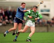 4 April 1999; James Moran of Limerick in action against Barry O'Sullivan of Dublin during the Church and General National Hurling League Division 1A match between Dublin and Limerick at Parnell Park in Dublin. Photo by Ray McManus/Sportsfile