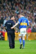 5 June 2005; Tipperary's Lar Corbett is attended to by team doctor Peter Murchan. Guinness Munster Senior Hurling Championship Semi-Final, Clare v Tipperary, Gaelic Grounds, Limerick. Picture credit; Kieran Clancy / SPORTSFILE