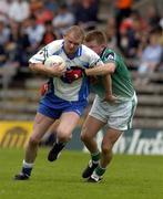 18 June 2005; James McElroy, Monaghan, in action against Paddy McConigley, London. Bank of Ireland All-Ireland Senior Football Championship Qualifier, Round 1, Monaghan v London, St. Tighernach's Park, Clones, Co. Monaghan. Picture credit; Pat Murphy / SPORTSFILE