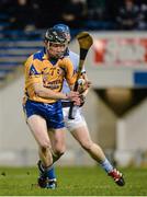 8 February 2014; Eugene McEntee, Portumna, clears the ball under pressure from Kevin Downes, Na Piarsaigh. AIB GAA Hurling All-Ireland Senior Club Championship Semi-Final, Portumna, Galway v Na Piarsaigh, Limerick. Semple Stadium, Thurles, Co. Tipperary. Picture credit: Ray McManus / SPORTSFILE