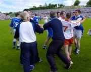 19 June 2005; Cavan and Tyrone players and officials get involved in a tussle after the game. Bank of Ireland Ulster Senior Football Championship Semi-Final, Tyrone v Cavan, St. Tighernach's Park, Clones, Co. Monaghan. Picture credit; Pat Murphy / SPORTSFILE