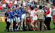 19 June 2005; Cavan and Tyrone players tussle after the game. Bank of Ireland Ulster Senior Football Championship Semi-Final, Tyrone v Cavan, St. Tighernach's Park, Clones, Co. Monaghan. Picture credit; Oliver McVeigh / SPORTSFILE