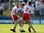 19 June 2005; Finbar O'Reilly of Cavan in action against Philip Jordan, left, and Ryan McMenamin of Tyrone during the Ulster GAA Football Senior Championship Semi-Final match between Tyrone and Cavan at at St Tiernach's Park in Monaghan. Photo by Pat Murphy/Sportsfile