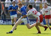 19 June 2005; Pauric Reilly, Cavan, in action against Brian McGuigan, Tyrone. Bank of Ireland Ulster Senior Football Championship Semi-Final, Tyrone v Cavan, St. Tighernach's Park, Clones, Co. Monaghan. Picture credit; Pat Murphy / SPORTSFILE