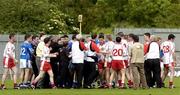 19 June 2005; Players and staff from both Tyrone and Cavan get involved in a tussle after the game. Bank of Ireland Ulster Senior Football Championship Semi-Final, Tyrone v Cavan, St. Tighernach's Park, Clones, Co. Monaghan. Picture credit; Ciara Lyster / SPORTSFILE