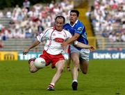 19 June 2005; Brian Dooher, Tyrone, in action against Mark McKeever, Cavan. Bank of Ireland Ulster Senior Football Championship Semi-Final, Tyrone v Cavan, St. Tighernach's Park, Clones, Co. Monaghan. Picture credit; Ciara Lyster / SPORTSFILE