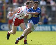 19 June 2005; Mark McKeever, Cavan, in action against Enda McGinley, Tyrone. Bank of Ireland Ulster Senior Football Championship Semi-Final, Tyrone v Cavan, St. Tighernach's Park, Clones, Co. Monaghan. Picture credit; Pat Murphy / SPORTSFILE