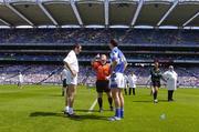 19 June 2005; Referee John Geaney tosses the coin as team captains John Doyle, left, Kildare, and Kevin Fitzpatrick, Laois, look on. Bank of Ireland Leinster Senior Football Championship Semi-Final, Laois v Kildare, Croke Park, Dublin. Picture credit; Brian Lawless / SPORTSFILE